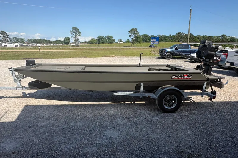 Slide: The Image of 2026 Gator Tail 1748 Gator Series boat on trailer, parked outdoors. - 5