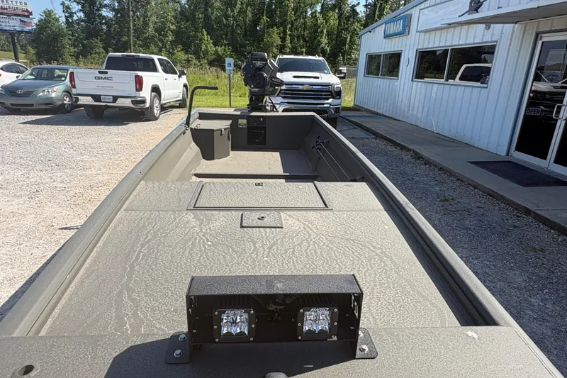 Slide: The Image of 2026 Gator Tail 1748 Gator Series boat displayed outdoors near dealership. - 6