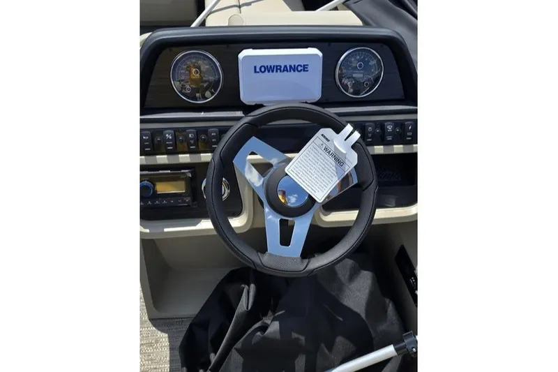 Slide: The Image of Steering wheel and dashboard of 2025 Godfrey Sweetwater 2286 MT boat with Lowrance display. - 5