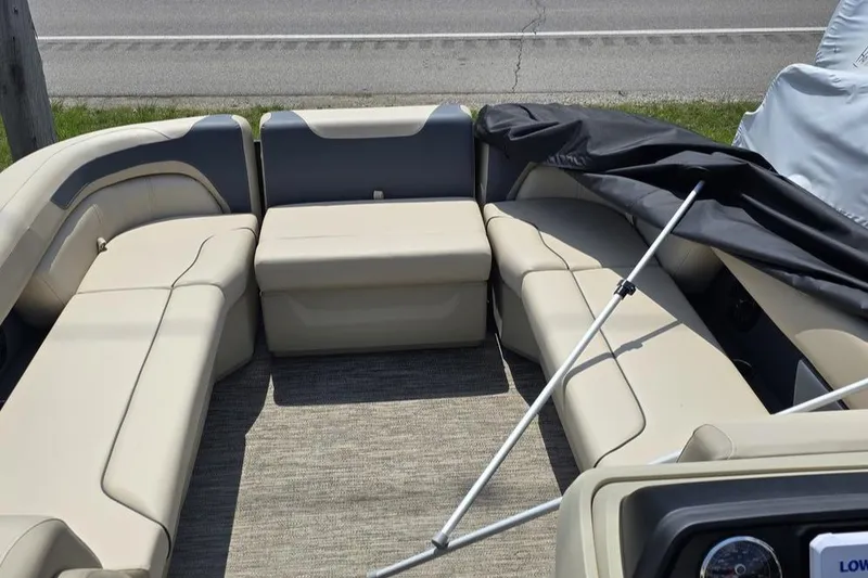 Slide: The Image of Interior of 2025 Godfrey Sweetwater 2286 MT pontoon boat with beige seating. - 6