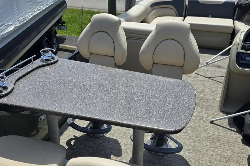 Slide: The Image of Interior of 2025 Godfrey Sweetwater 2286 MT pontoon boat with seating and table. - 9