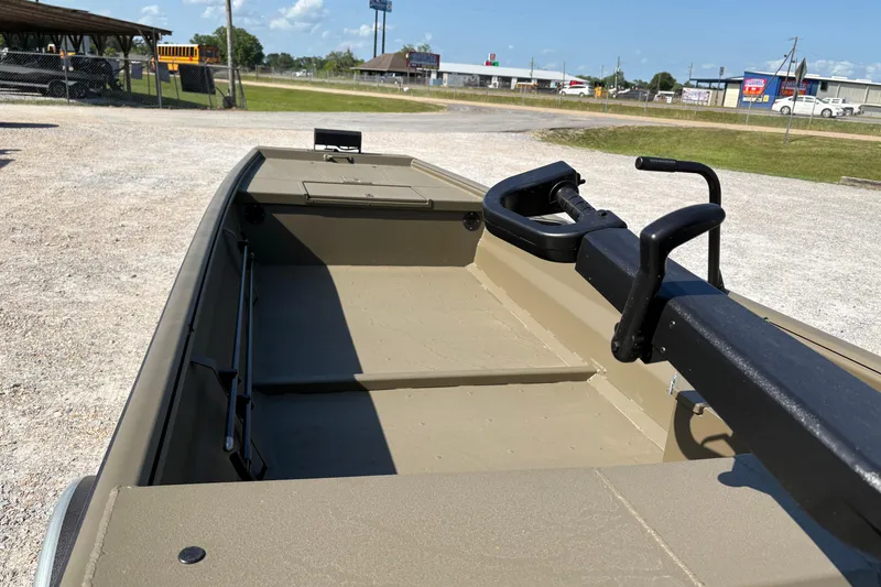 Slide: The Image of 2026 Gator Tail 1748 Gator Series boat, beige interior, parked outdoors. - 3