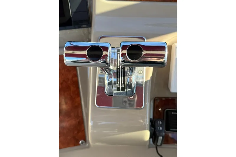 Slide: The Image of Chrome throttle controls on a 1998 Maxum 3700 SCR boat dashboard. - 10