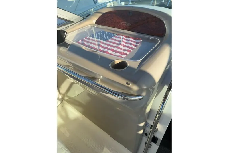 Slide: The Image of 1998 Maxum 3700 SCR boat dashboard with American flag display. - 11