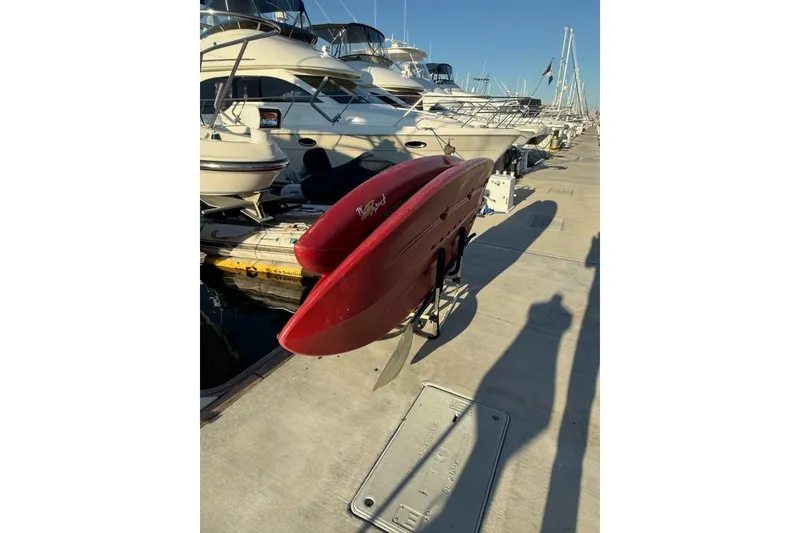 Slide: The Image of Red Maxum 3700 SCR boat docked at marina, surrounded by other vessels, sunny day. - 28