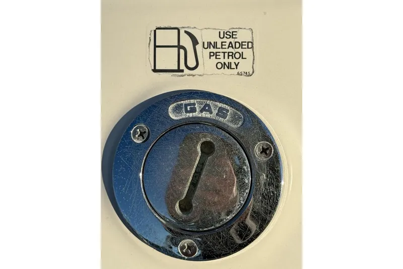 Slide: The Image of Fuel cap of 1998 Maxum 3700 SCR boat, labeled "Use Unleaded Petrol Only." - 31