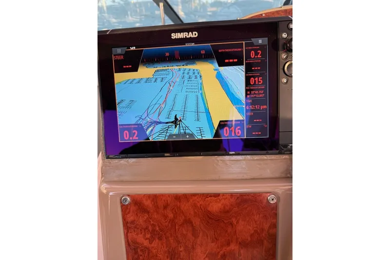 Slide: The Image of Simrad navigation display on 1998 Maxum 3700 SCR boat dashboard. - 42
