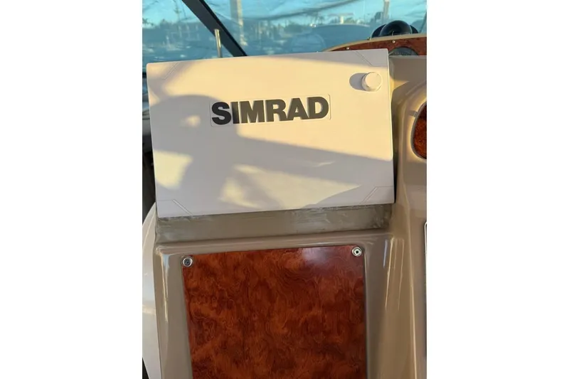 Slide: The Image of Simrad navigation system on 1998 Maxum 3700 SCR boat dashboard. - 43