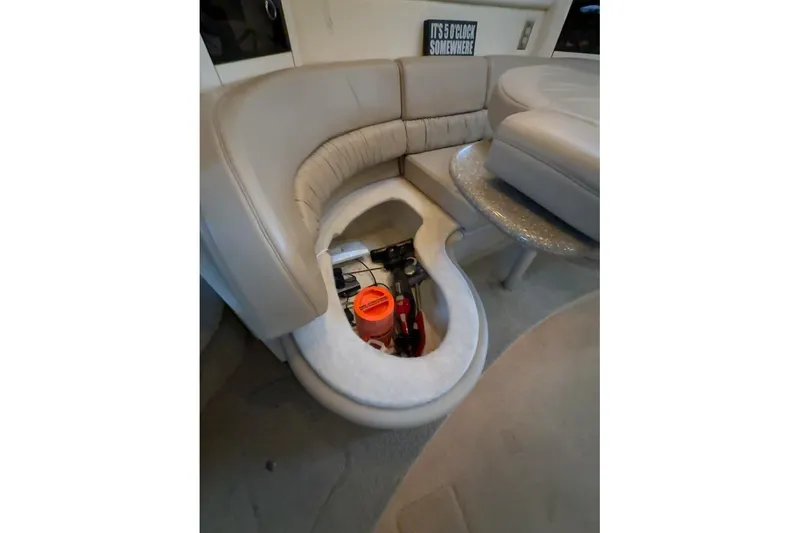 Slide: The Image of Interior of 1998 Maxum 3700 SCR yacht showing hidden storage compartment under seating. - 55