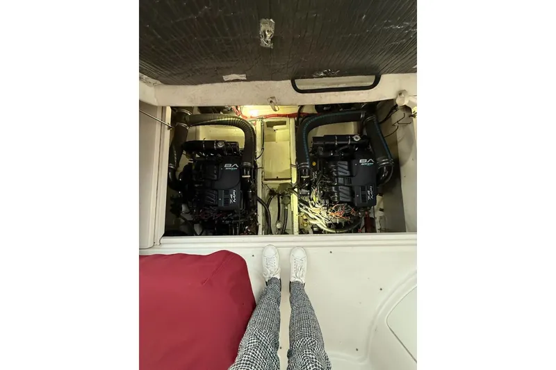 Slide: The Image of Engine compartment of a 1998 Maxum 3700 SCR boat with dual engines visible. - 57