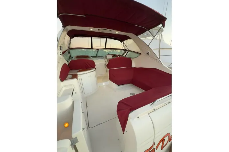 Slide: The Image of 1998 Maxum 3700 SCR yacht interior with red seating and canopy. - 59