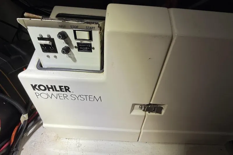 Slide: The Image of Kohler power system in a 1998 Maxum 3700 SCR boat engine compartment. - 63