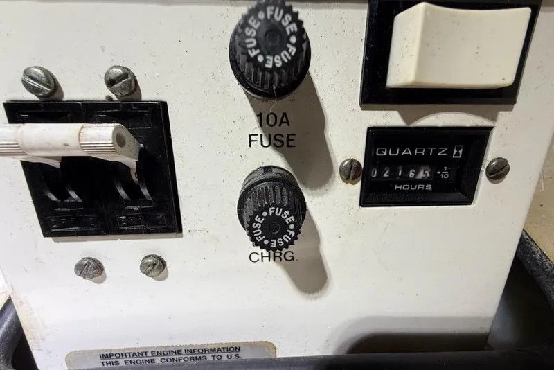 Slide: The Image of Control panel of a 1998 Maxum 3700 SCR boat with fuses and hour meter. - 64