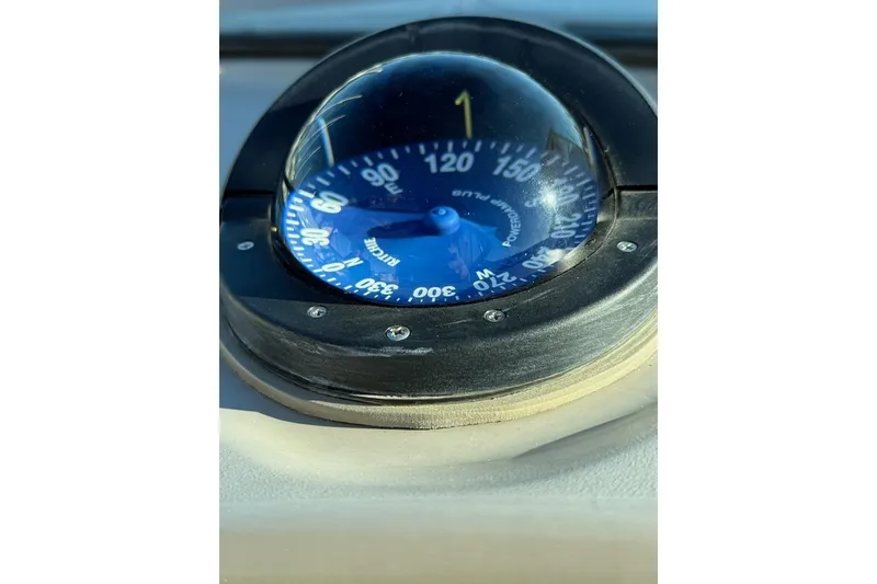 Slide: The Image of Compass on 1998 Maxum 3700 SCR boat dashboard, displaying navigational directions. - 7