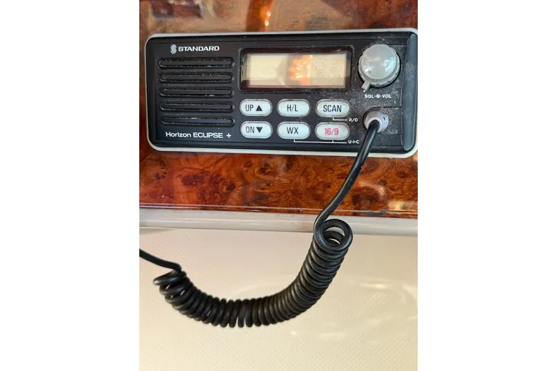 Slide: The Image of Standard Horizon Eclipse+ radio on 1998 Maxum 3700 SCR boat dashboard. - 8