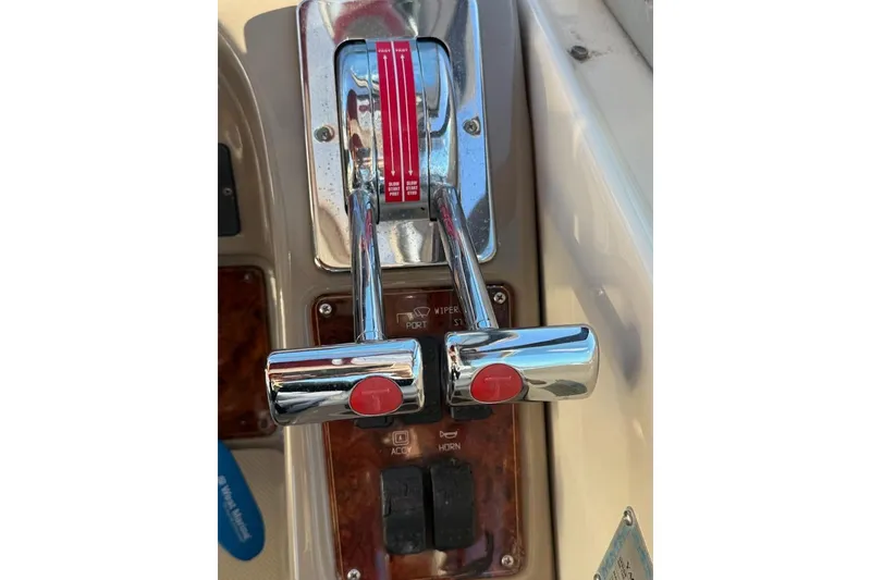 Slide: The Image of Chrome throttle controls on a 1998 Maxum 3700 SCR boat dashboard. - 9