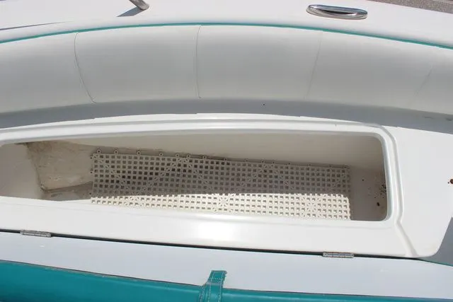 Slide: The Image of Glasstream 240 CCX 2018 boat storage compartment with grid floor. - 15