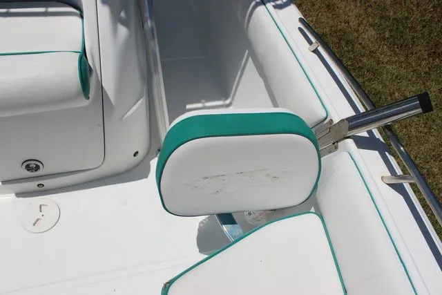Slide: The Image of Interior of a 2018 Glasstream 240 CCX boat with white and teal seating. - 19