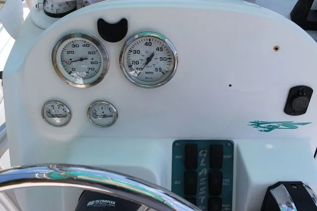 Slide: The Image of Dashboard of a 2018 Glasstream 240 CCX boat with gauges. - 22