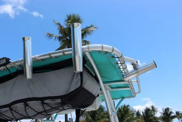 Slide: The Image of Glasstream 240 CCX 2018 boat with fishing rod holders and blue sky. - 32