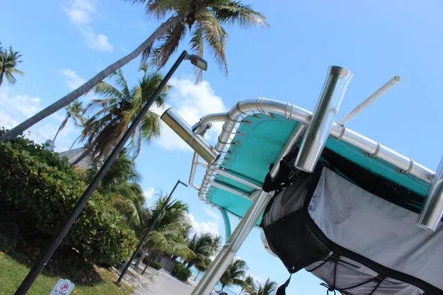 Slide: The Image of 2018 Glasstream 240 CCX boat with palm trees in the background. - 33