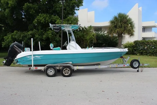 Slide: The Image of 2018 Glasstream 240 CCX boat on trailer, turquoise color. - 4