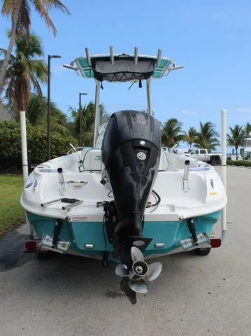 Slide: The Image of 2018 Glasstream 240 CCX boat with outboard motor, parked on a road. - 41