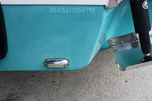 Slide: The Image of Rear view of a 2018 Glasstream 240 CCX boat with serial number. - 44