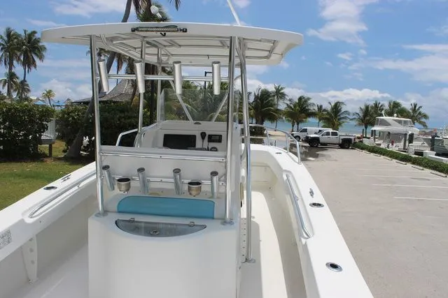 Slide: The Image of 2017 Twin Vee OceanCat 260 TE boat by the beach with palm trees. - 12