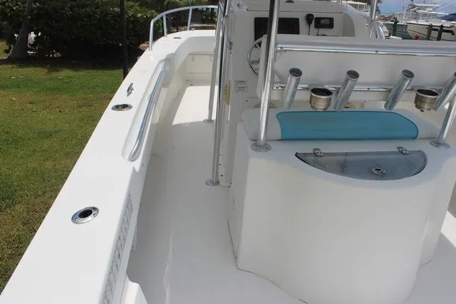 Slide: The Image of 2017 Twin Vee OceanCat 260 TE boat interior with fishing rod holders. - 14