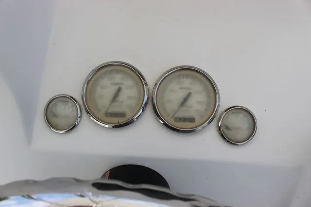Slide: The Image of Dashboard of 2017 Twin Vee OceanCat 260 TE with four gauges. - 19