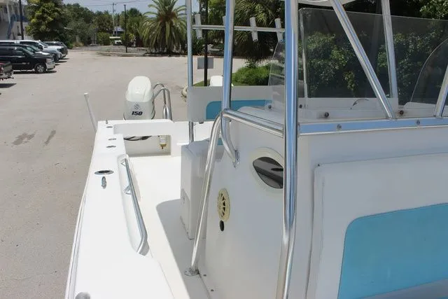 Slide: The Image of 2017 Twin Vee OceanCat 260 TE boat, side view at dock. - 23
