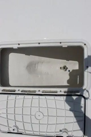 Slide: The Image of Open storage compartment of a 2017 Twin Vee OceanCat 260 TE boat. - 30