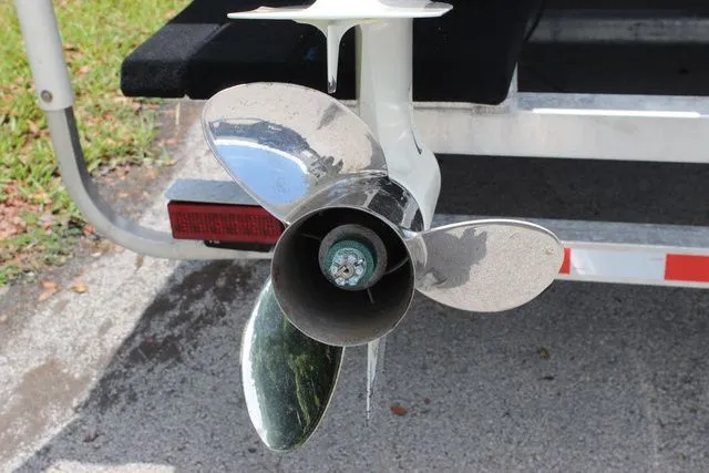 Slide: The Image of Propeller of a 2017 Twin Vee OceanCat 260 TE boat on a trailer. - 32