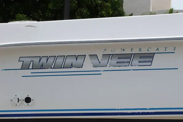 Slide: The Image of 2017 Twin Vee OceanCat 260 TE boat side with logo. - 5