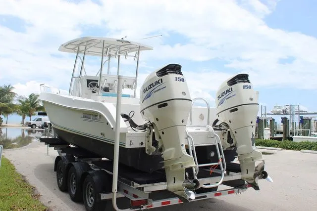Slide: The Image of 2017 Twin Vee OceanCat 260 TE with Suzuki engines on trailer. - 8