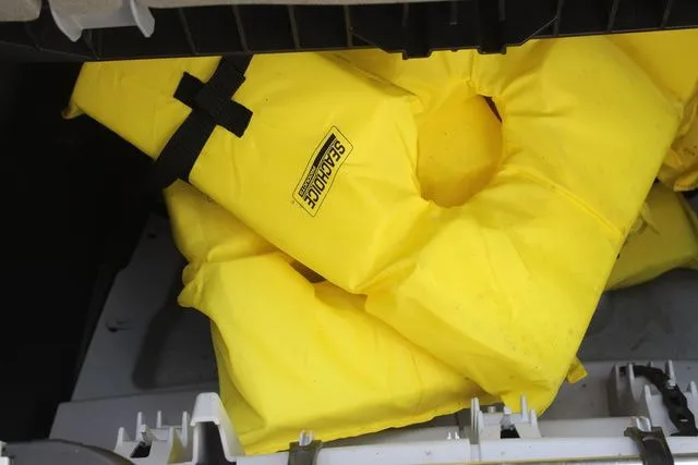 Slide: The Image of Yellow life jackets in Sea-Doo Switch Cruise 21, 2023 model. - 22