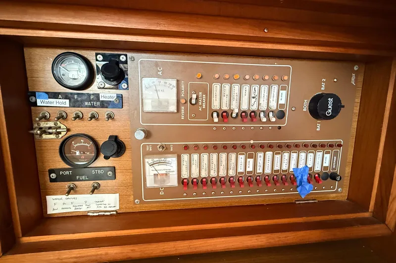 Slide: The Image of Electrical control panel of a 1983 Tanton 44 boat with gauges and switches. - 10