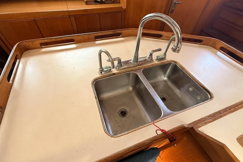 Slide: The Image of Double stainless steel sink in 1983 Tanton 44 yacht galley. - 17