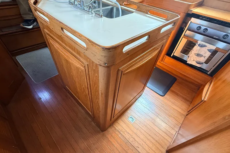 Slide: The Image of Wooden kitchen interior of 1983 Tanton 44 yacht with sink and oven. - 28