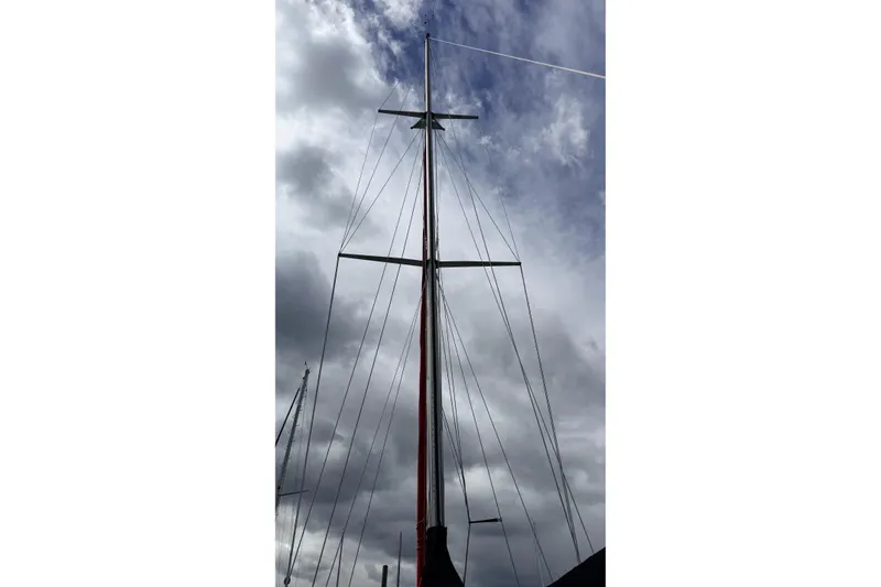 Slide: The Image of Tall mast of 1983 Tanton 44 sailboat against cloudy sky. - 38