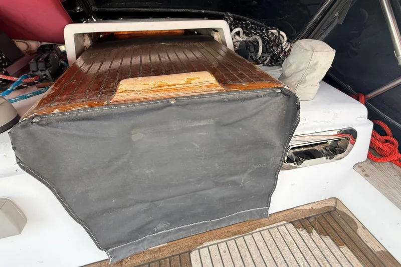 Slide: The Image of 1983 Tanton 44 sailboat cockpit with wooden hatch and nautical equipment. - 40
