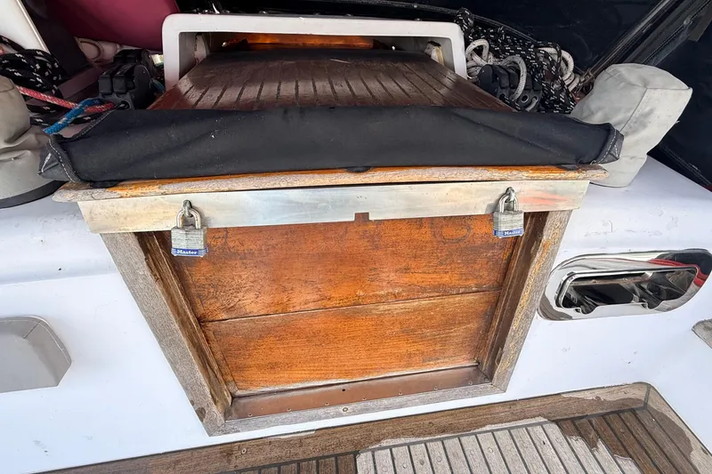 Slide: The Image of Wooden hatch with padlocks on a 1983 Tanton 44 sailboat deck. - 44
