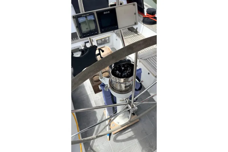 Slide: The Image of Steering wheel and navigation instruments on a 1983 Tanton 44 sailboat. - 46