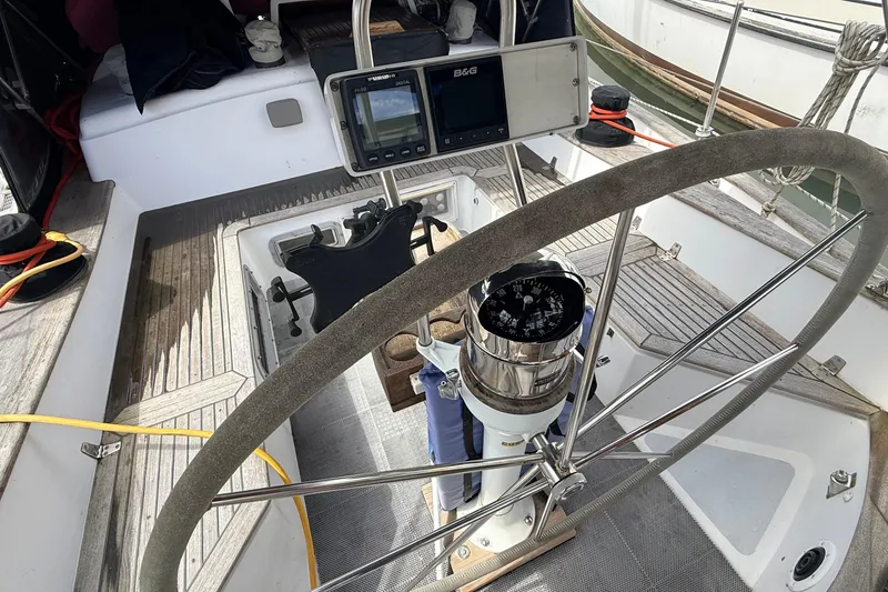 Slide: The Image of Cockpit of 1983 Tanton 44 sailboat with steering wheel and navigation instruments. - 47
