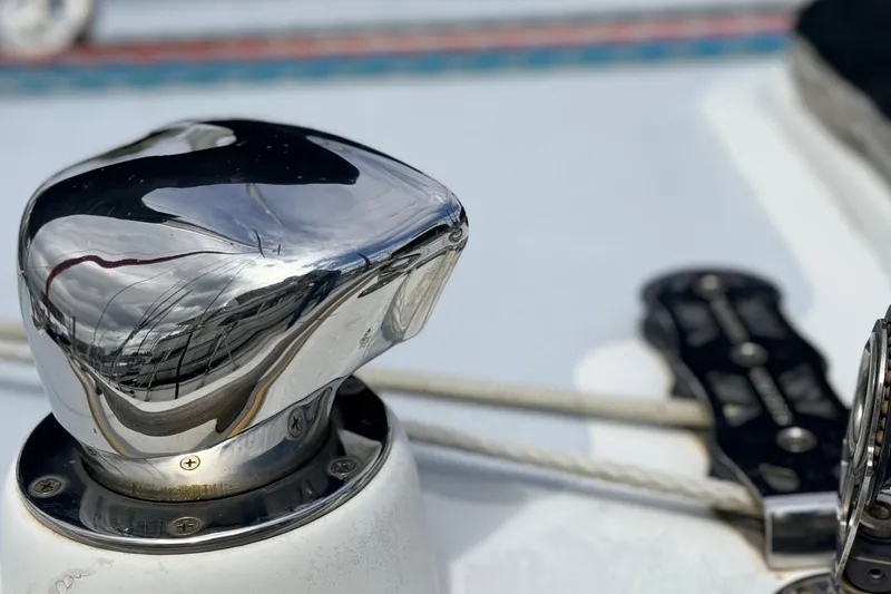 Slide: The Image of Close-up of a polished winch on a 1983 Tanton 44 sailboat deck. - 48