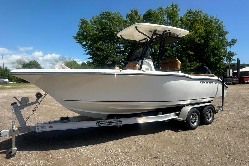 The Image of 2026 Key West 239 FS boat on trailer, parked outdoors under clear sky. - 0
