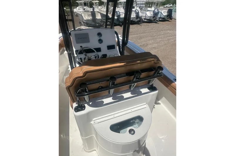 Slide: The Image of 2026 Key West 239 FS boat interior with helm, seating, and rod holders. - 11