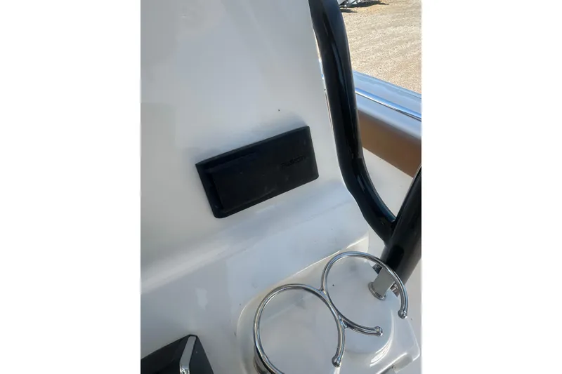 Slide: The Image of 2026 Key West 239 FS boat interior with cup holders and black handle. - 13