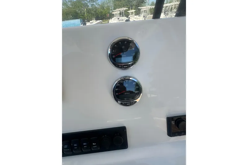 Slide: The Image of Dashboard of 2026 Key West 239 FS boat with dual gauges and controls. - 15